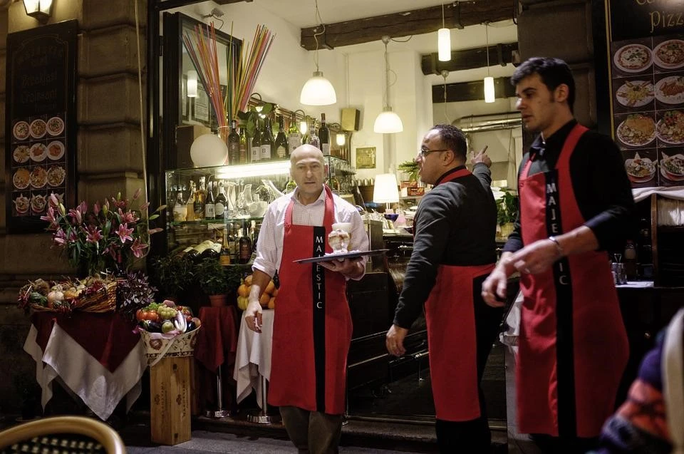 Manager and workers in a shop