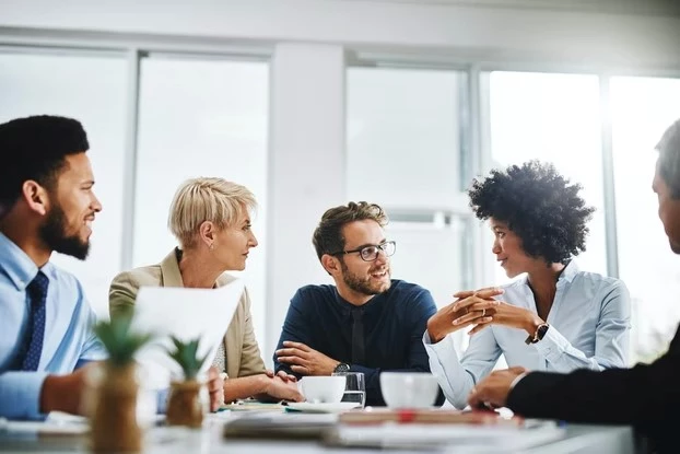 Workers meeting around a table