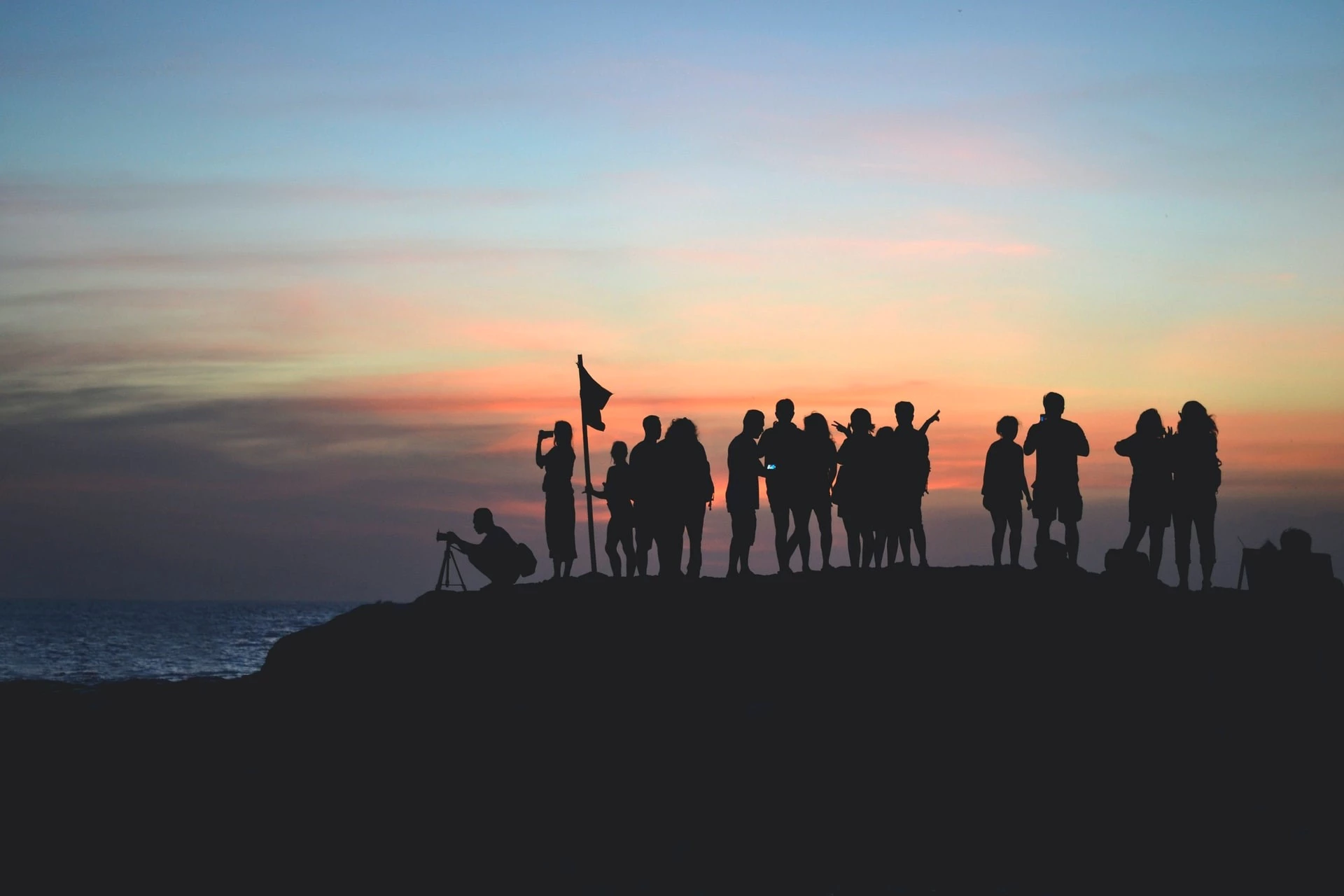 A team of people by the ocean